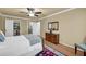 The bedroom features hardwood floors, neutral walls, closet and ensuite bathroom at 1851 Mount Vernon Rd, Dunwoody, GA 30338