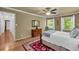This bedroom is flooded with natural light and features hardwood floors at 1851 Mount Vernon Rd, Dunwoody, GA 30338