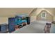 Bonus room with vaulted ceilings is a cozy retreat featuring a TV and comfortable seating at 1851 Mount Vernon Rd, Dunwoody, GA 30338