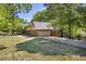 Spacious home with a two-car garage, set on a beautifully landscaped lot with mature trees at 1851 Mount Vernon Rd, Dunwoody, GA 30338