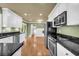 Stylish kitchen with white cabinets, granite countertops, and stainless steel appliances at 1851 Mount Vernon Rd, Dunwoody, GA 30338