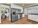 Well-equipped kitchen with stainless steel appliances and an open view to the dining area at 1851 Mount Vernon Rd, Dunwoody, GA 30338