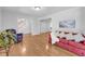Bright living room features hardwood floors, neutral paint, and access to the staircase at 1851 Mount Vernon Rd, Dunwoody, GA 30338