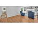 Spacious living room with hardwood floors, fireplace, and view to an adjacent room at 1851 Mount Vernon Rd, Dunwoody, GA 30338