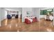 Spacious living room features a brick fireplace, hardwood floors, and built-in shelving at 1851 Mount Vernon Rd, Dunwoody, GA 30338