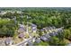 Aerial view of a charming neighborhood surrounded by lush trees, showcasing the home's location and community at 5011 Weathervane Dr, Alpharetta, GA 30022