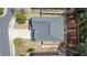 Aerial view of a well-maintained home with a spacious driveway and beautifully landscaped backyard, showcasing great curb appeal at 5011 Weathervane Dr, Alpharetta, GA 30022