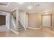 Basement featuring tile floors, a staircase, access to other rooms, and plenty of storage at 5011 Weathervane Dr, Alpharetta, GA 30022