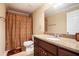 Cozy bathroom with granite countertop, updated vanity, and tiled shower at 5011 Weathervane Dr, Alpharetta, GA 30022