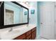 Bright bathroom featuring a double sink vanity, large mirror, and neutral paint at 5011 Weathervane Dr, Alpharetta, GA 30022