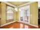 Charming breakfast nook with ample natural light and access to the outdoor area at 5011 Weathervane Dr, Alpharetta, GA 30022