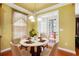 Cozy breakfast nook with seating for four, perfect for casual dining and morning coffee at 5011 Weathervane Dr, Alpharetta, GA 30022