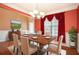 Elegant dining room with chandelier, stylish decor, and comfortable seating for six at 5011 Weathervane Dr, Alpharetta, GA 30022