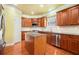 Spacious kitchen with island, stainless appliances, and plenty of counter space at 5011 Weathervane Dr, Alpharetta, GA 30022