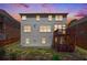 A cozy home features a two-story deck, complemented by a well-maintained backyard and landscaped garden at 5011 Weathervane Dr, Alpharetta, GA 30022