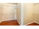 Spacious walk-in closet with shelving and hardwood floors, providing ample storage at 5011 Weathervane Dr, Alpharetta, GA 30022