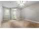 Neutral bedroom featuring a ceiling fan, door to balcony, and a window at 4201 Stratford Commons, Decatur, GA 30033