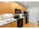 Well-equipped kitchen featuring black appliances, and light-colored cabinetry at 4201 Stratford Commons, Decatur, GA 30033