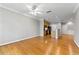 Open-concept living space with hardwood floors and a view into the kitchen at 4201 Stratford Commons, Decatur, GA 30033