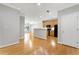 Open-concept living space with hardwood floors, neutral tones, and an adjoining kitchen area at 4201 Stratford Commons, Decatur, GA 30033