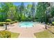 Inviting community pool surrounded by lush landscaping and comfortable lounge chairs at 4201 Stratford Commons, Decatur, GA 30033