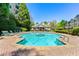 Community pool surrounded by well-maintained landscaping at 4201 Stratford Commons, Decatur, GA 30033