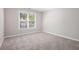 Bright bedroom with carpet flooring and a view of the backyard at 4609 Mctyre Way, Marietta, GA 30064