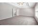 View of bedroom with carpet and ceiling fan and door to bathroom at 4609 Mctyre Way, Marietta, GA 30064