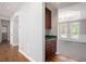 Hallway leading to dining area with beautiful wainscoting and a view of the landscaped yard at 4609 Mctyre Way, Marietta, GA 30064