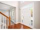 Inviting foyer with hardwood floors, a staircase, and natural light streaming through the windows at 4609 Mctyre Way, Marietta, GA 30064