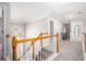 Hallway on the upper level with access to multiple rooms and a view of the staircase and foyer at 4609 Mctyre Way, Marietta, GA 30064