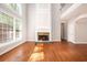 Open-concept living area featuring hardwood floors, a fireplace, and soaring ceilings at 4609 Mctyre Way, Marietta, GA 30064