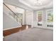 Foyer with a staircase, large windows, and a view of the front yard, creating an inviting entrance at 4609 Mctyre Way, Marietta, GA 30064