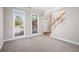 Bright, carpeted living room with large windows and view to the front yard at 4609 Mctyre Way, Marietta, GA 30064