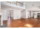 Expansive living space with hardwood flooring, fireplace, and open layout to the kitchen at 4609 Mctyre Way, Marietta, GA 30064