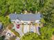 Aerial view of townhomes with parking, surrounded by lush trees at 595 Saint James Se Walk, Marietta, GA 30067