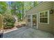 Exterior view of backyard showing partial view of house, patio and yard with shed at 595 Saint James Se Walk, Marietta, GA 30067