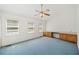 Spacious bedroom with three windows, a ceiling fan and built-in cabinets/desk at 595 Saint James Se Walk, Marietta, GA 30067