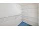 Walk-in closet with white shelving at 595 Saint James Se Walk, Marietta, GA 30067