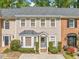 Charming townhouse with a well-manicured front yard and classic architectural details at 595 Saint James Se Walk, Marietta, GA 30067