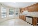 Well-lit kitchen featuring wood cabinets, stainless steel appliances, and bright countertops at 595 Saint James Se Walk, Marietta, GA 30067