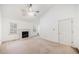 Spacious living room with a vaulted ceiling, fireplace, and lots of natural light at 595 Saint James Se Walk, Marietta, GA 30067
