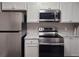 Up-close view of stainless steel oven, range, microwave, and refrigerator at 6401 Wedgeview Ct # 6401, Tucker, GA 30084