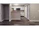 Open-concept kitchen featuring white cabinets, granite countertops, and stainless steel appliances at 6401 Wedgeview Ct # 6401, Tucker, GA 30084