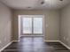 Living room features hard surface flooring and large windows at 6401 Wedgeview Ct # 6401, Tucker, GA 30084