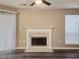 Cozy living room showcasing a classic fireplace and hardwood floors at 6401 Wedgeview Ct # 6401, Tucker, GA 30084