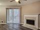 Living room with fireplace and sliding glass door to patio at 6401 Wedgeview Ct # 6401, Tucker, GA 30084