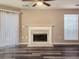 Bright living room featuring fireplace and hardwood floors at 6401 Wedgeview Ct # 6401, Tucker, GA 30084