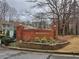 Welcoming neighborhood sign for Wedgewood community featuring manicured landscaping at 6401 Wedgeview Ct # 6401, Tucker, GA 30084