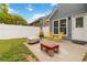 Charming backyard with patio, seating, and a well-maintained fence at 900 Hillary Ln, Lawrenceville, GA 30043